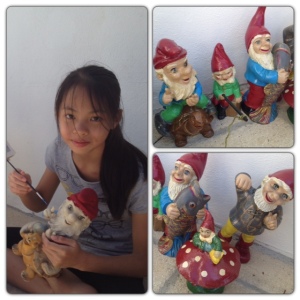 Megan giving the gnomes that papa had as a kid a new lease of life with pots of tester paint from B&Q